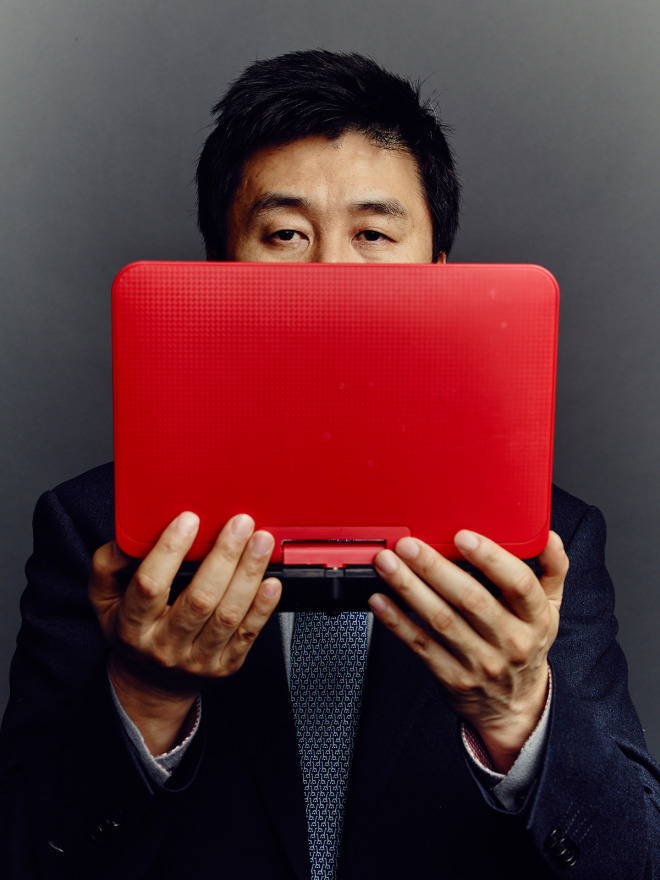 Kang Chol-hwan, leader of the dissident group NKSC, with a popular video player caleed a notel.